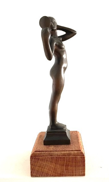 bronze figure holding mirror