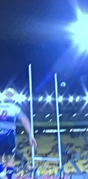 to the right of the post