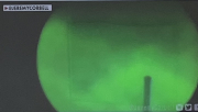 black mark in a green circle