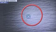 white object in red circle